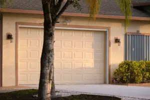 Garage door replacement in Katy, TX, featuring a modern design that enhances home aesthetics and energy efficiency, surrounded by landscaping elements.