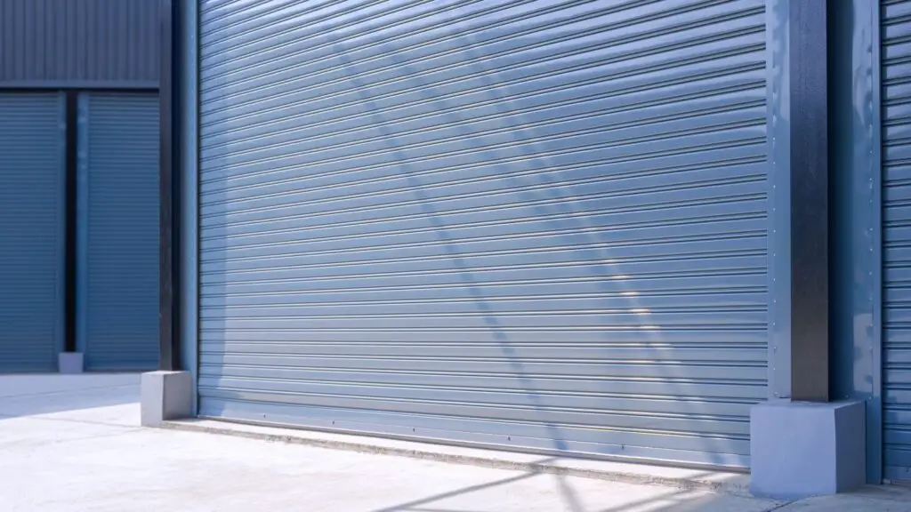 Garage door with rolled steel panels, showcasing a modern design and sturdy construction, relevant to garage door maintenance and repair services.